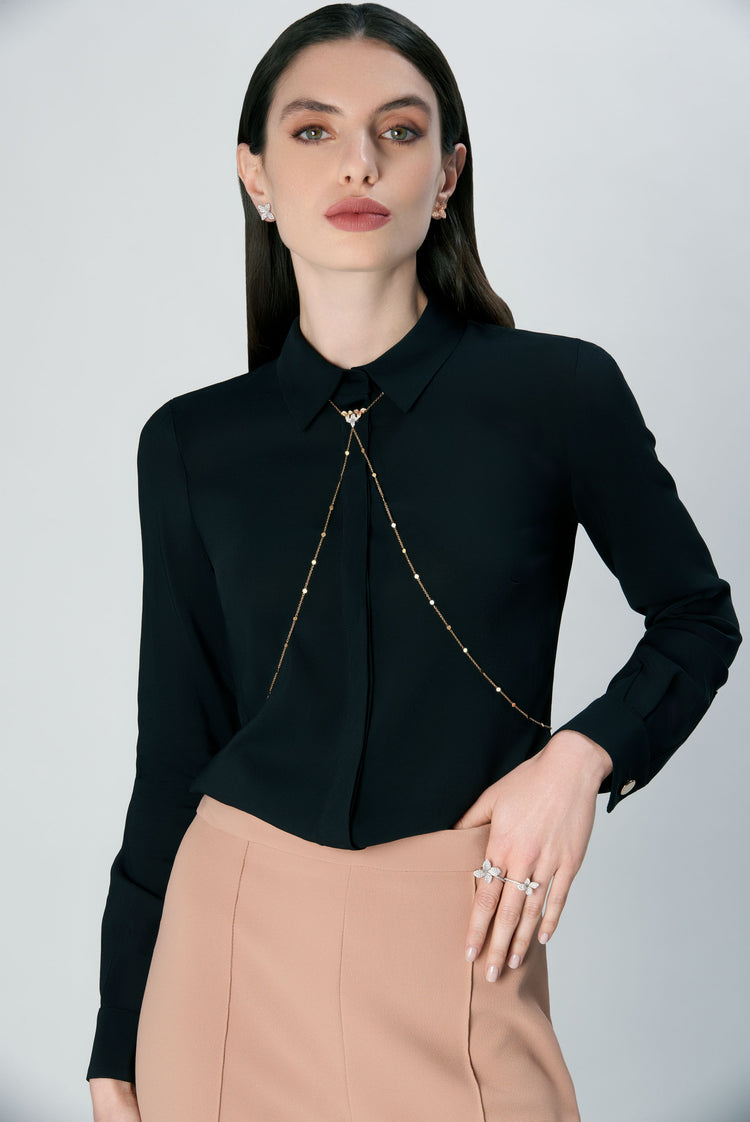 Body sautoir and earrings in 18k white and rose gold with diamonds on model in black blouse