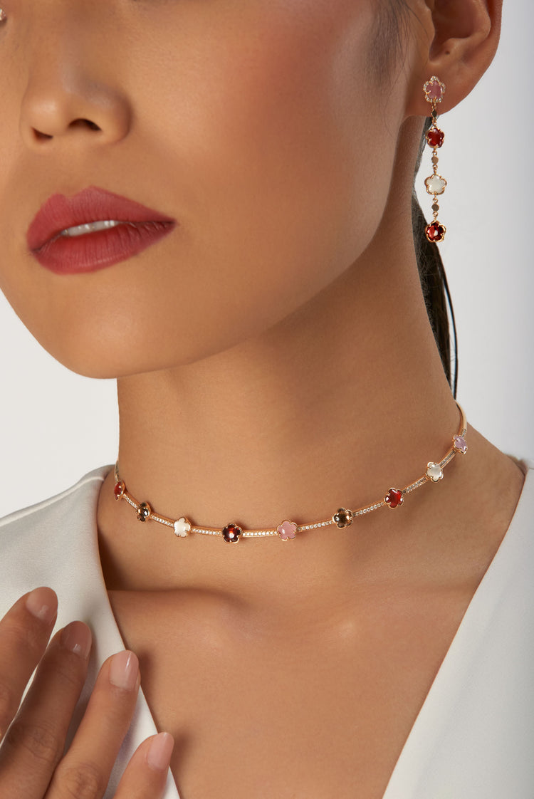 Choker and earring in 18k rose gold with gemstones on model