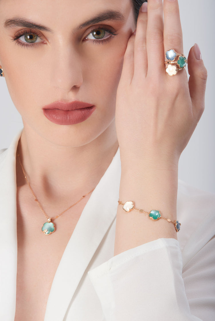 Necklace, bracelet, and ring in 18k rose gold with pearl gem, diamonds and colored stones on model i…
