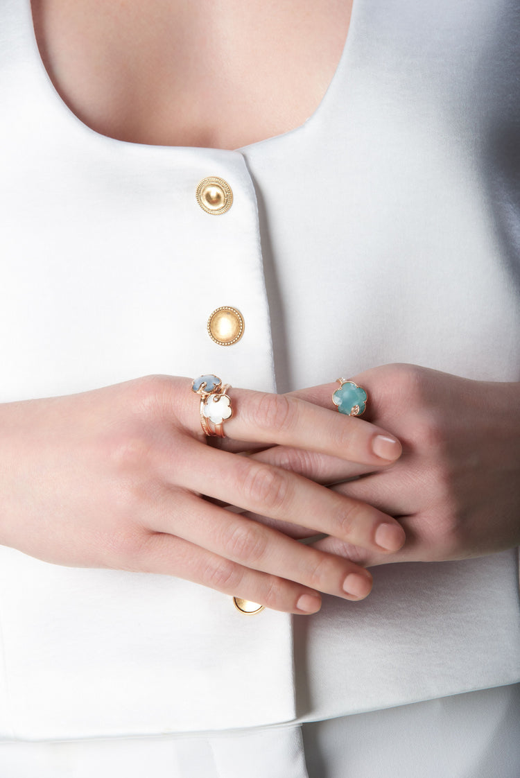 Combination of rings with coloured gems on model.