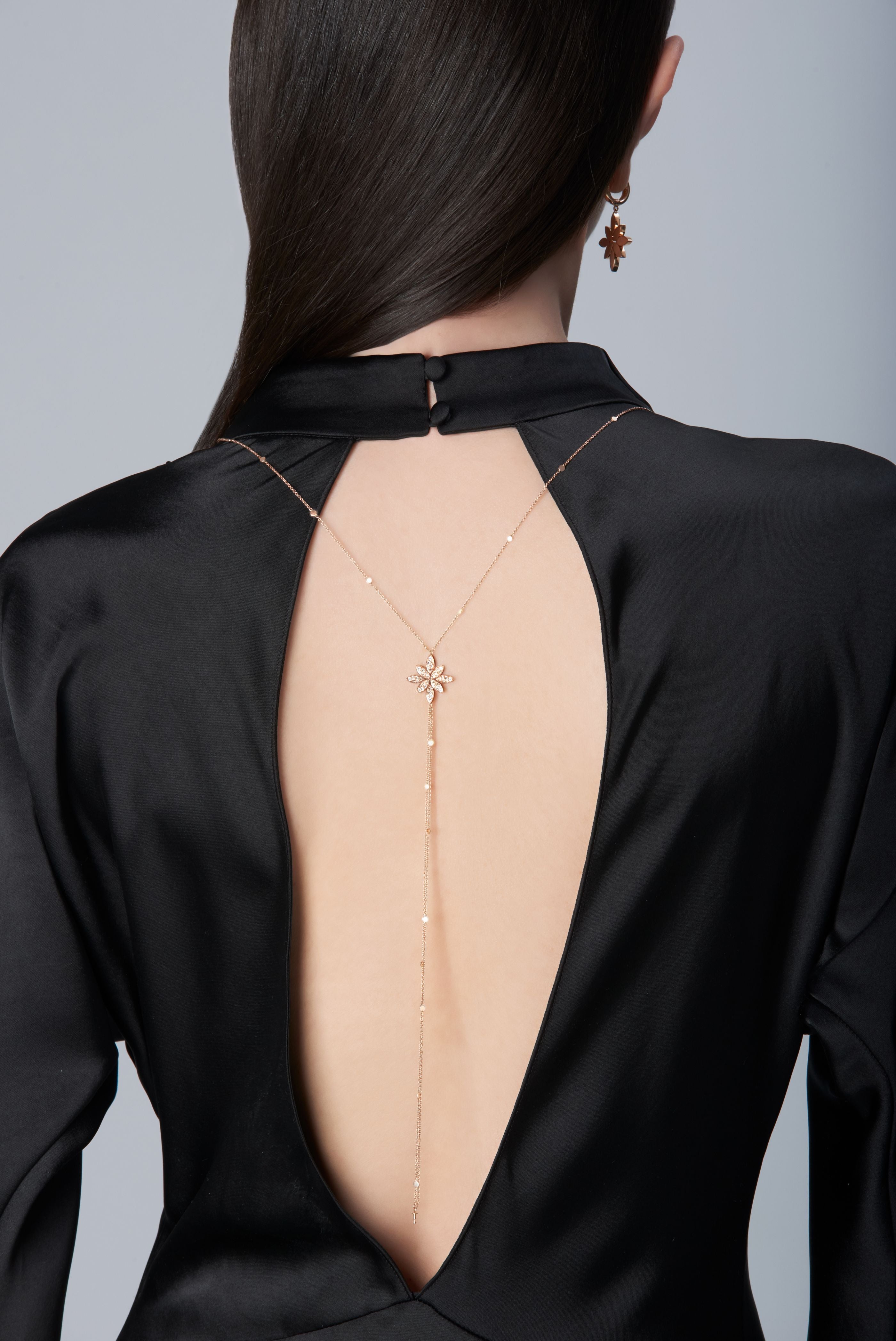 Model wearing a black dress and Sautoir in 18k Rose Gold with Diamonds