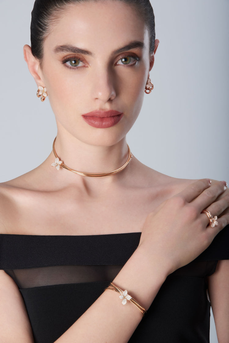 Choker, earrings, bracelet and ring in 18k Rose Gold with Diamonds on model with black dress