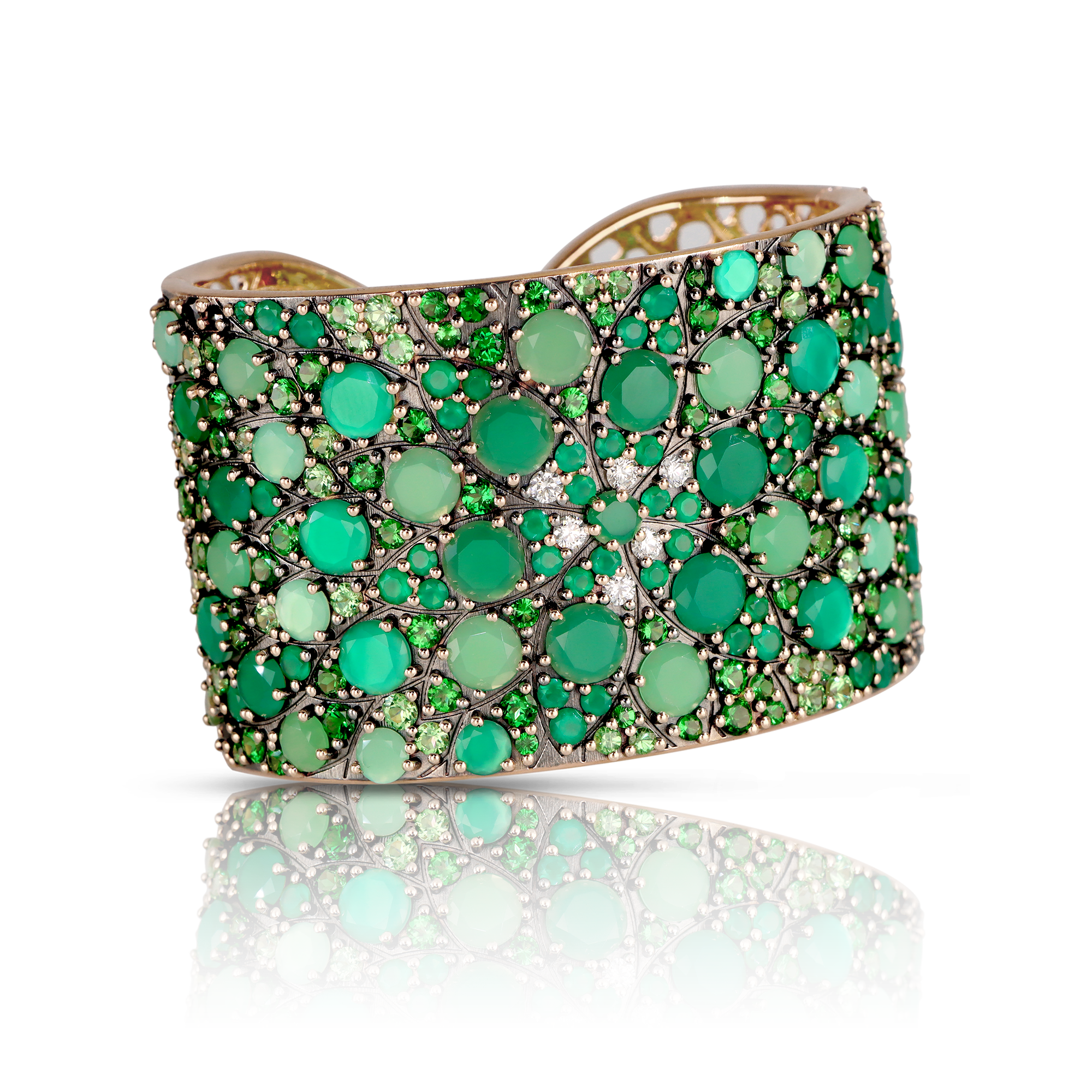 Bangle Bracelet with diamonds and green gemstones.