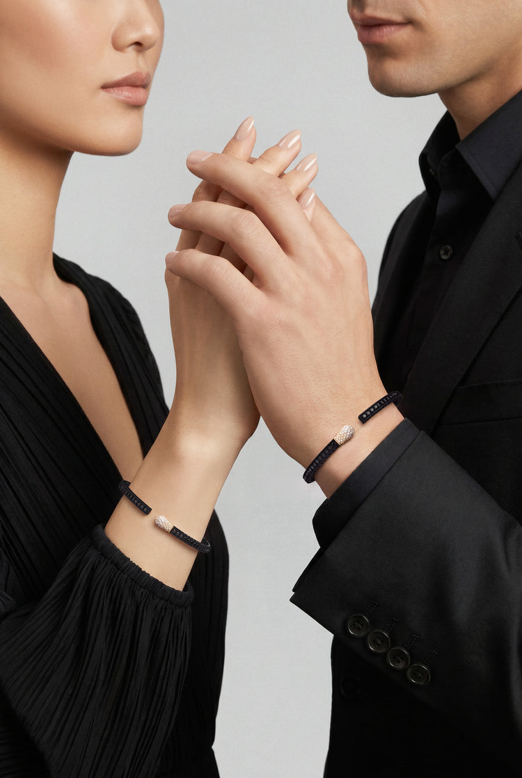 Models with black outfits wearing Bracelets in 18k Rose Gold and Black titanium with white, black and champagne diamonds