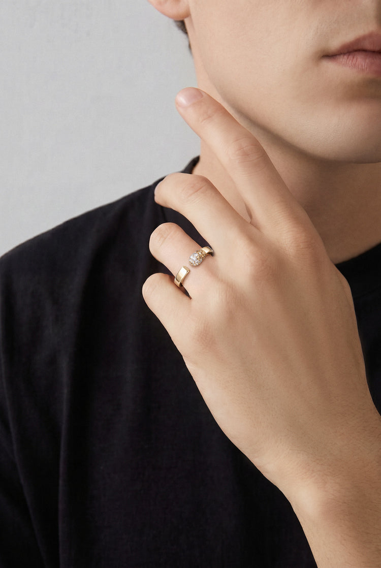 Model wearing a Ring in 18k Rose Gold with White and Champagne Diamonds with a black outfit