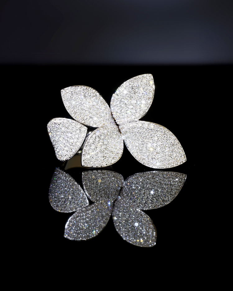 Ring Giardini Segreti with White Diamonds with black background.