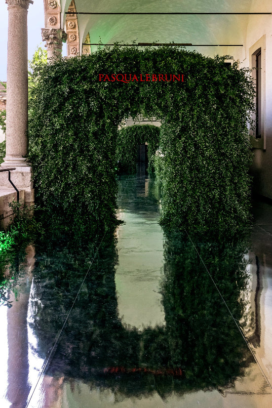 Decorative green archway with 'Pandolfini' sign in an elegant setting